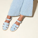 Blue suede SERA FISHERMAN sandal by FREDA SALVADOR featuring a casual, open-toe design with ankle straps.