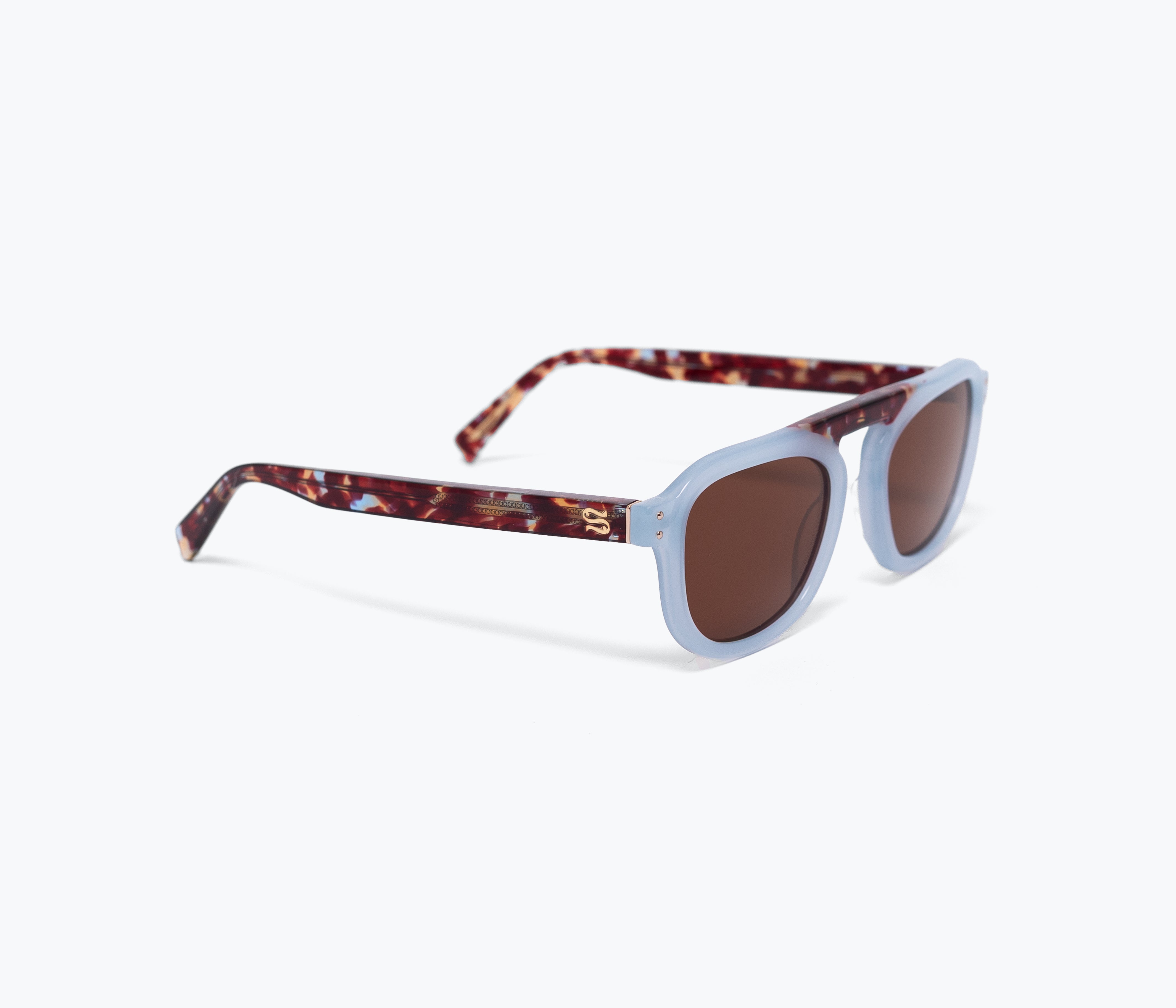 Sunglasses with tortoiseshell frame and brown lenses on a white background