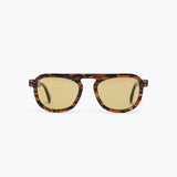Sunglasses with tortoiseshell frame and gold lenses on a white background