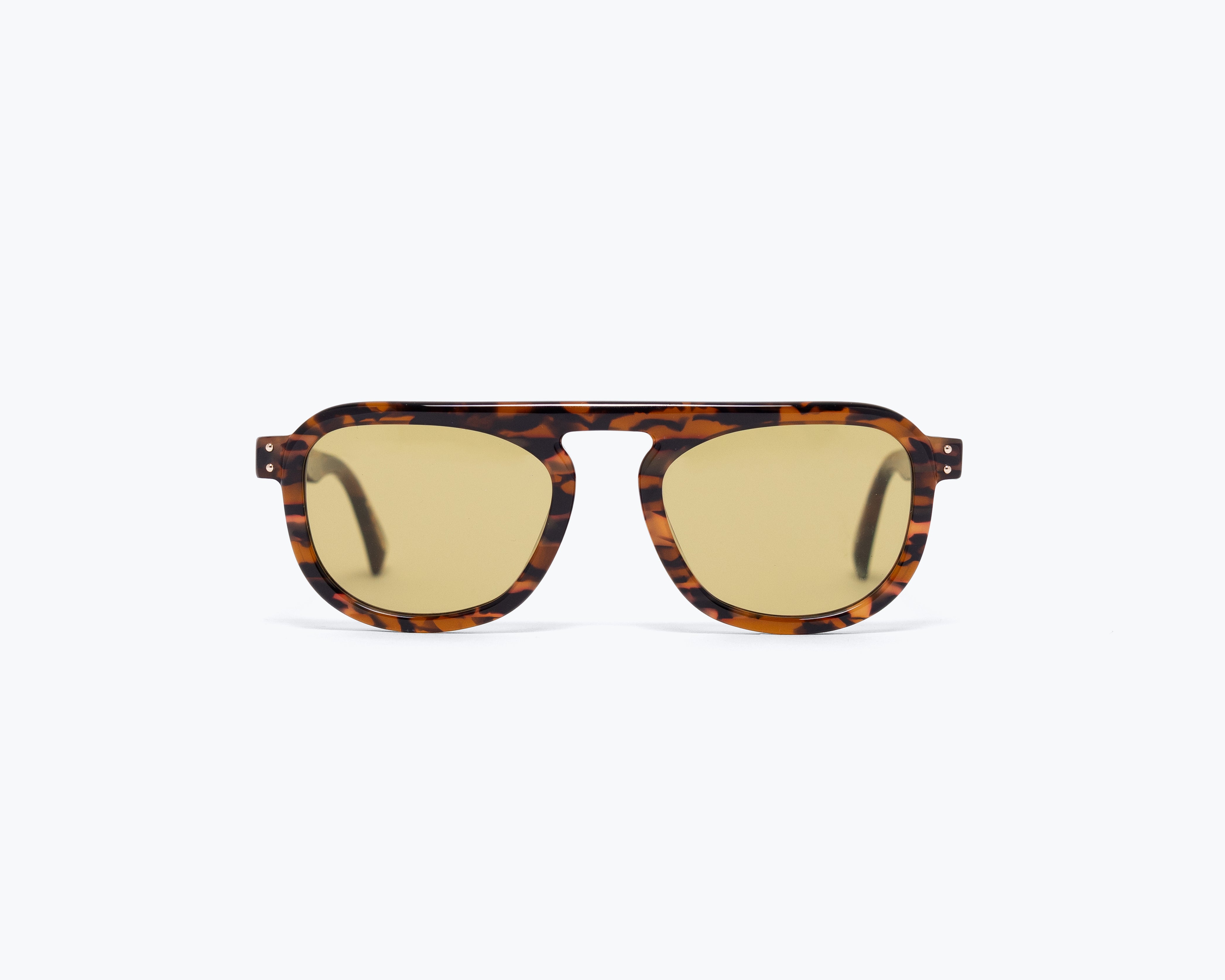 Sunglasses with tortoiseshell frame and gold lenses on a white background