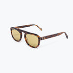 Sunglasses with tortoiseshell frame and gold lenses on a white background