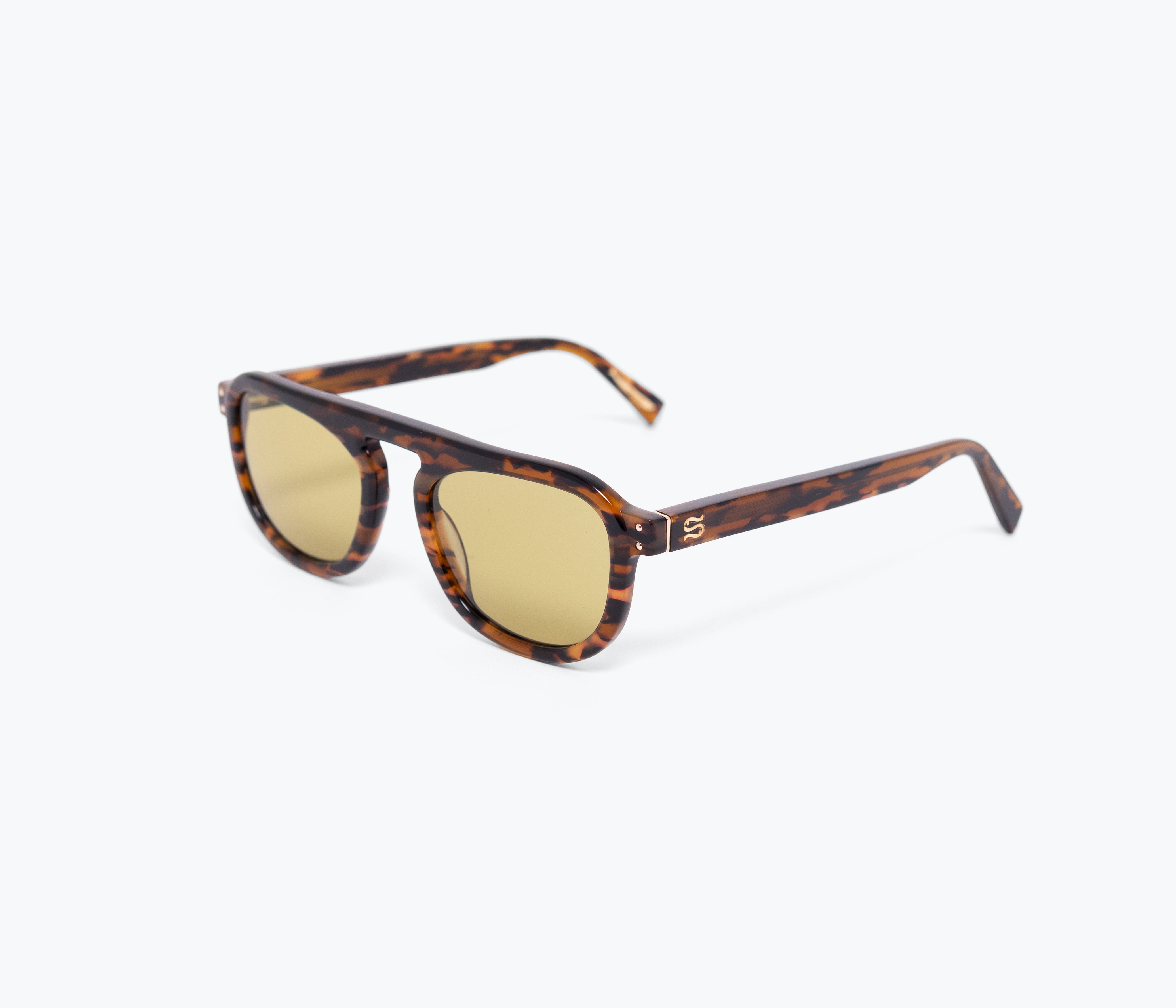 Sunglasses with tortoiseshell frame and gold lenses on a white background