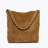 Freda Salvador CALA studded brown suede tote bag with sleek design and metal stud accents, front view.