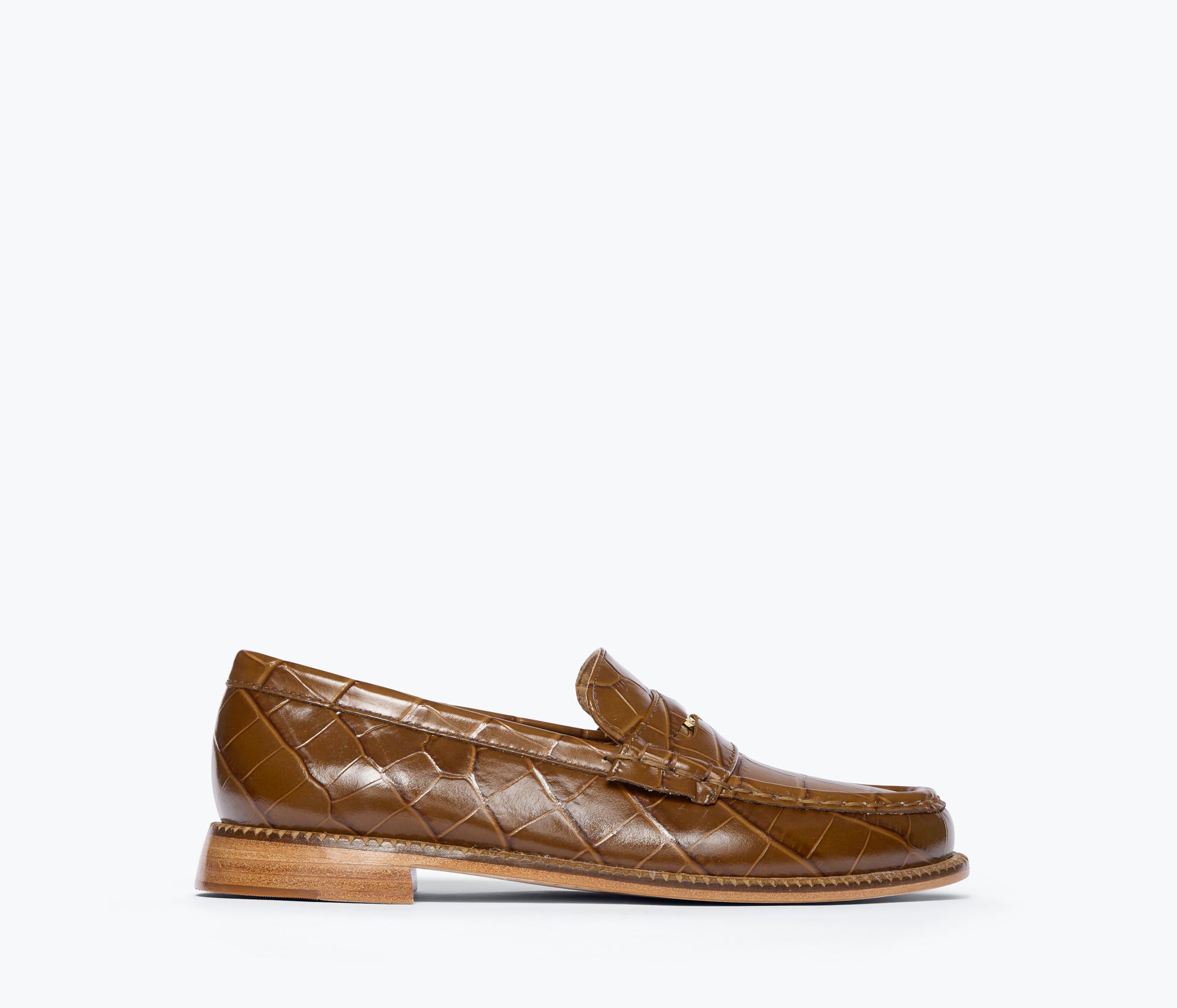 A single brown crocodile-embossed leather penny loafer shown in profile against a clean white background.