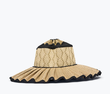 Beige straw hat with black trim on a white background