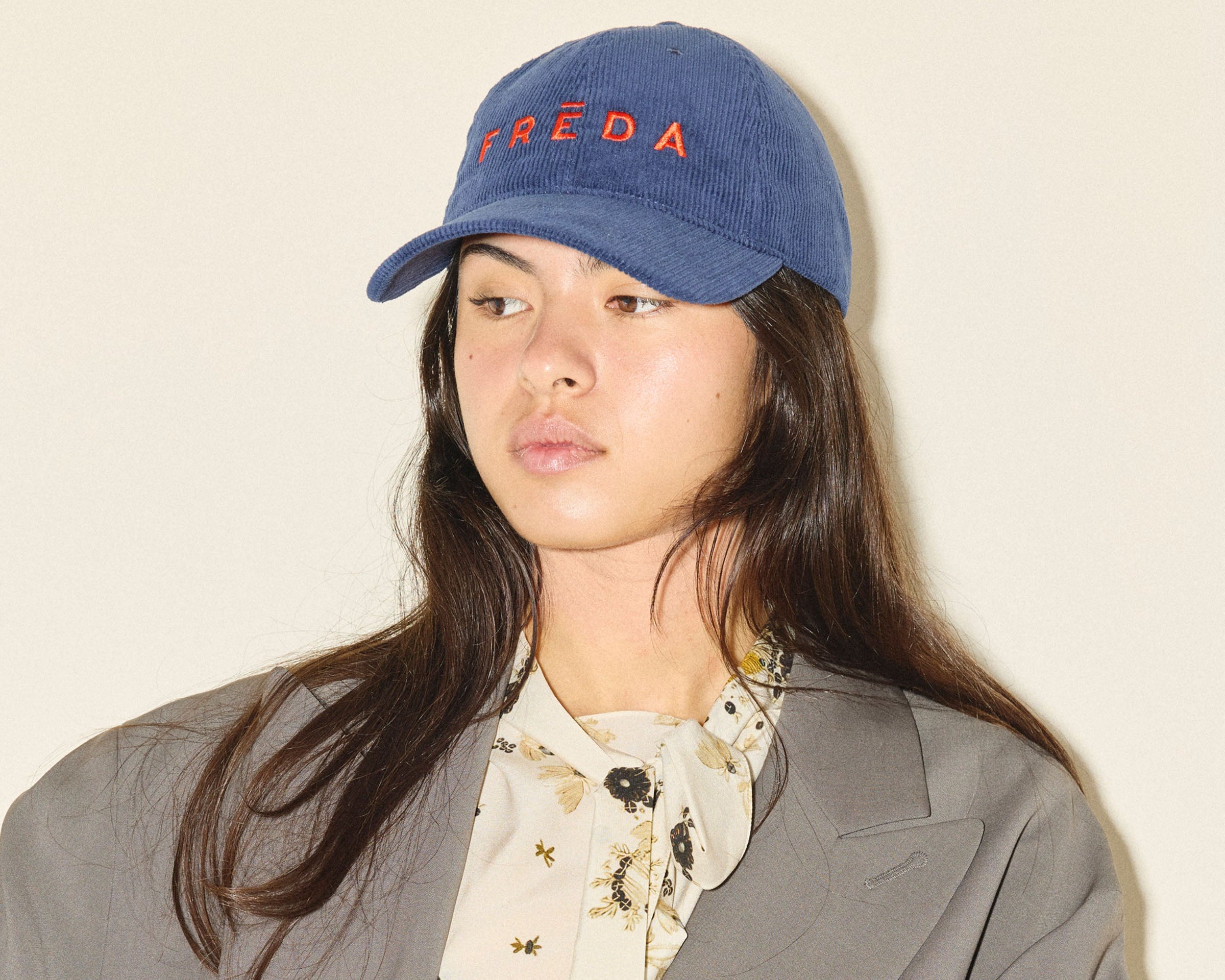 Embroidered Freda Hat in navy corduroy, on figure