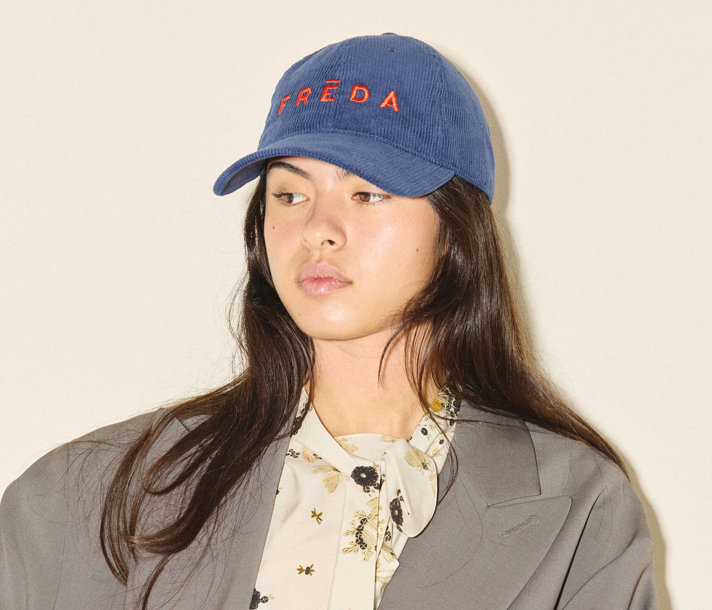 Embroidered Freda Hat in navy corduroy, on figure