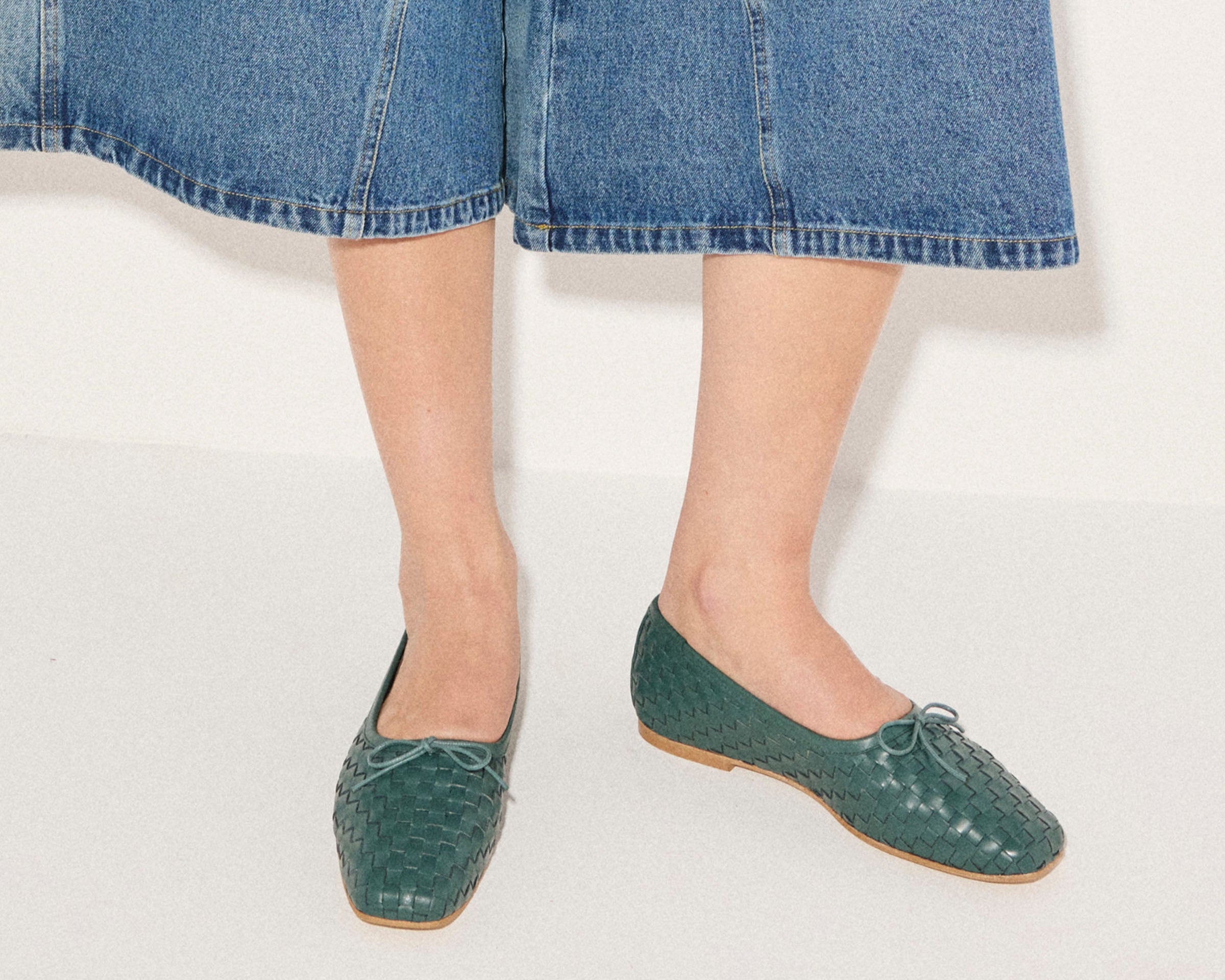 Freda Salvador JADA square toe ballet flat in emerald woven calf leather, featuring a sleek design and comfortable flat sole.