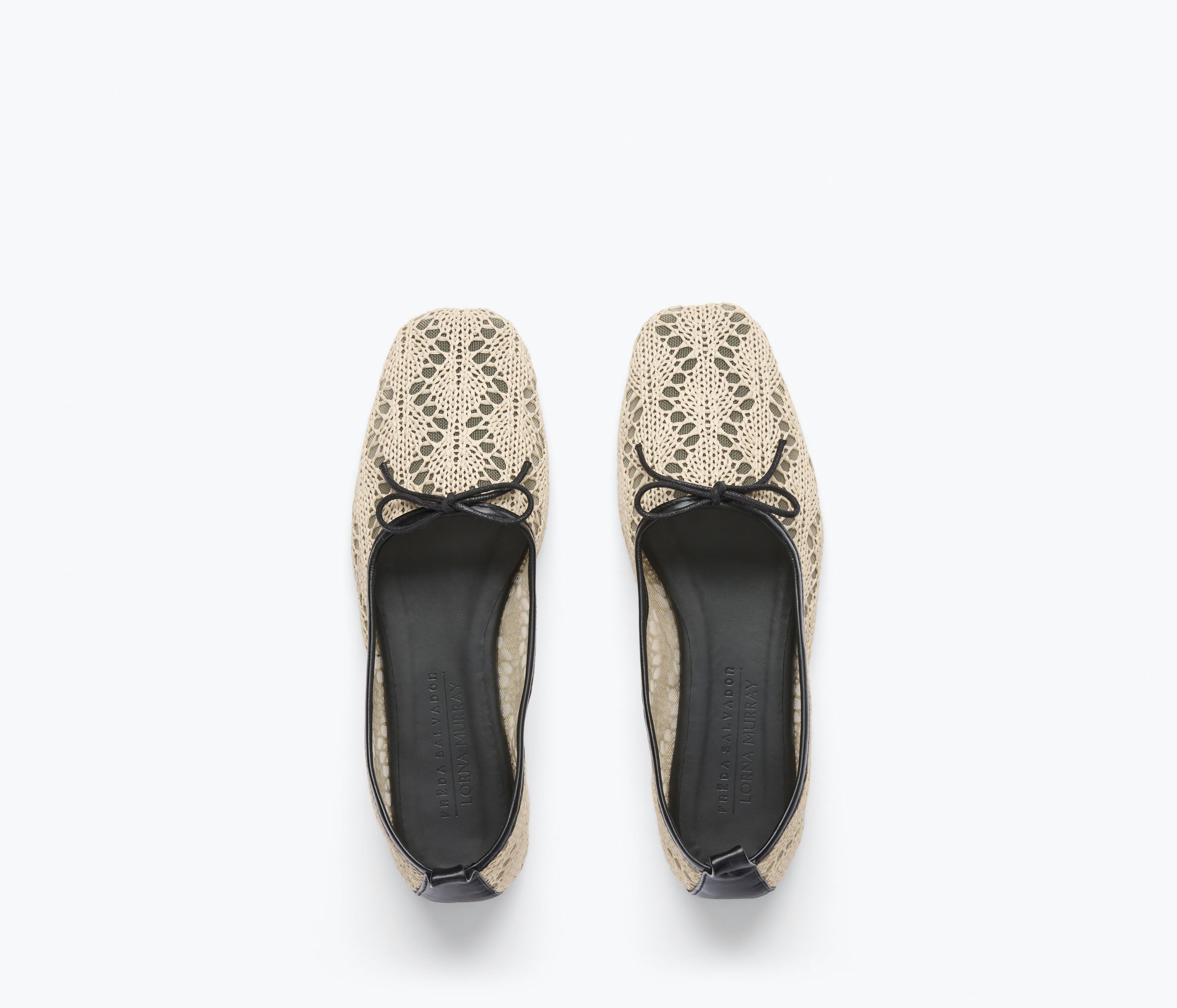 Pair of beige lace-up shoes on a white background