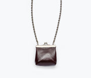 Freda Salvador KENZO mini purse necklace in wine crinkle patent leather, featuring a bag-shaped SLG with gold-tone chain detail.