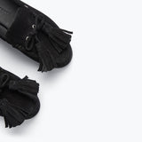 Black suede Freda Salvador Leon Tassel Penny Loafer Mule with tassel details and slip-on style.