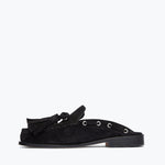 Black suede Leon tassel penny loafer mule by Freda Salvador, showing the inside view with tassel details and sleek design.
