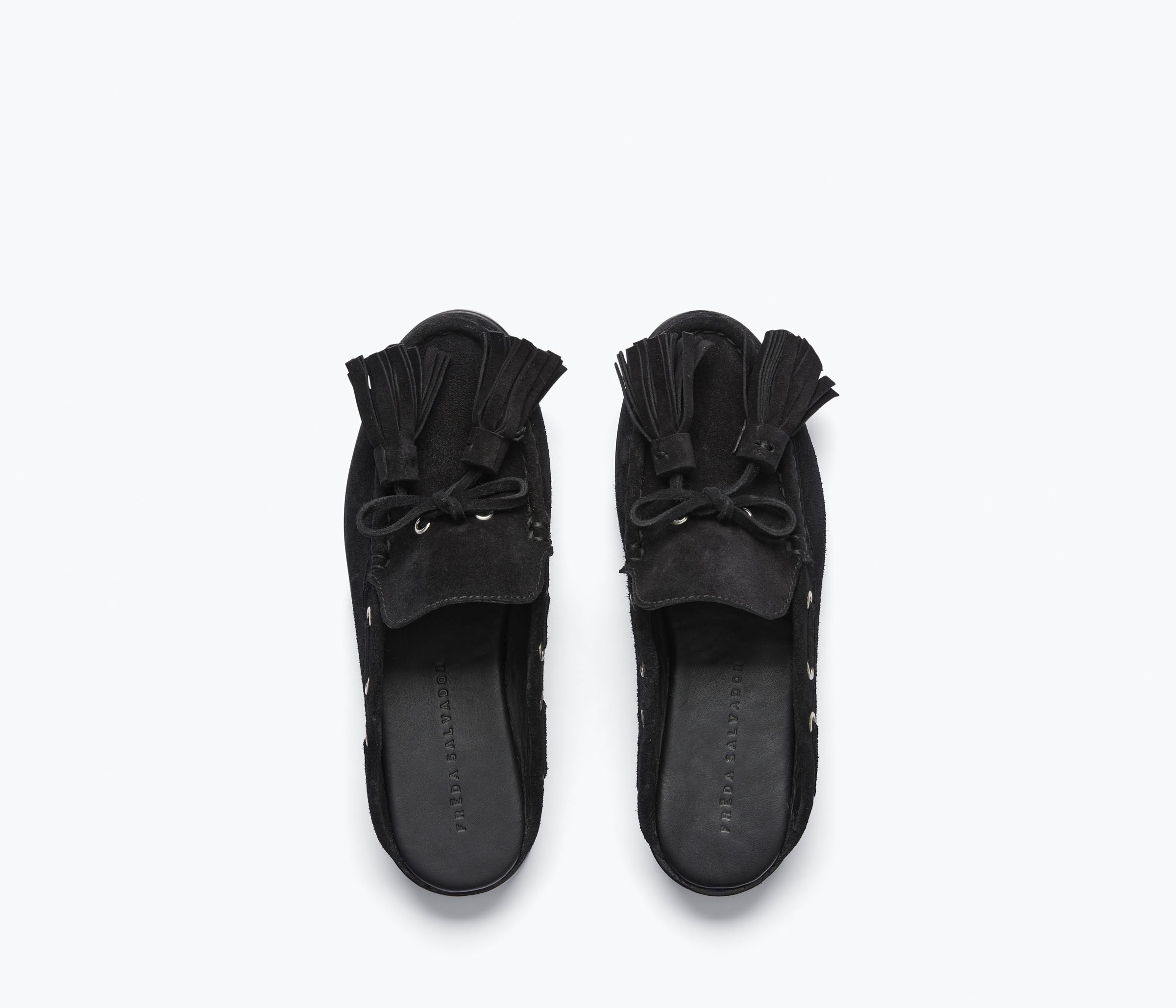 Black suede LEON tassel penny loafer mule by Freda Salvador with a sleek, minimalist slip-on design and tassel detail.