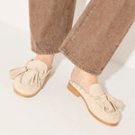 Freda Salvador Leon Tassel Penny Loafer Mule in Sahara suede featuring tassel detail and slip-on mule design.