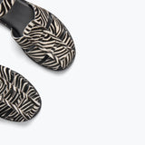 Freda Salvador Sera Fisherman Sandal with zebra print hair calf leather, showcasing detailed strap and textured material.
