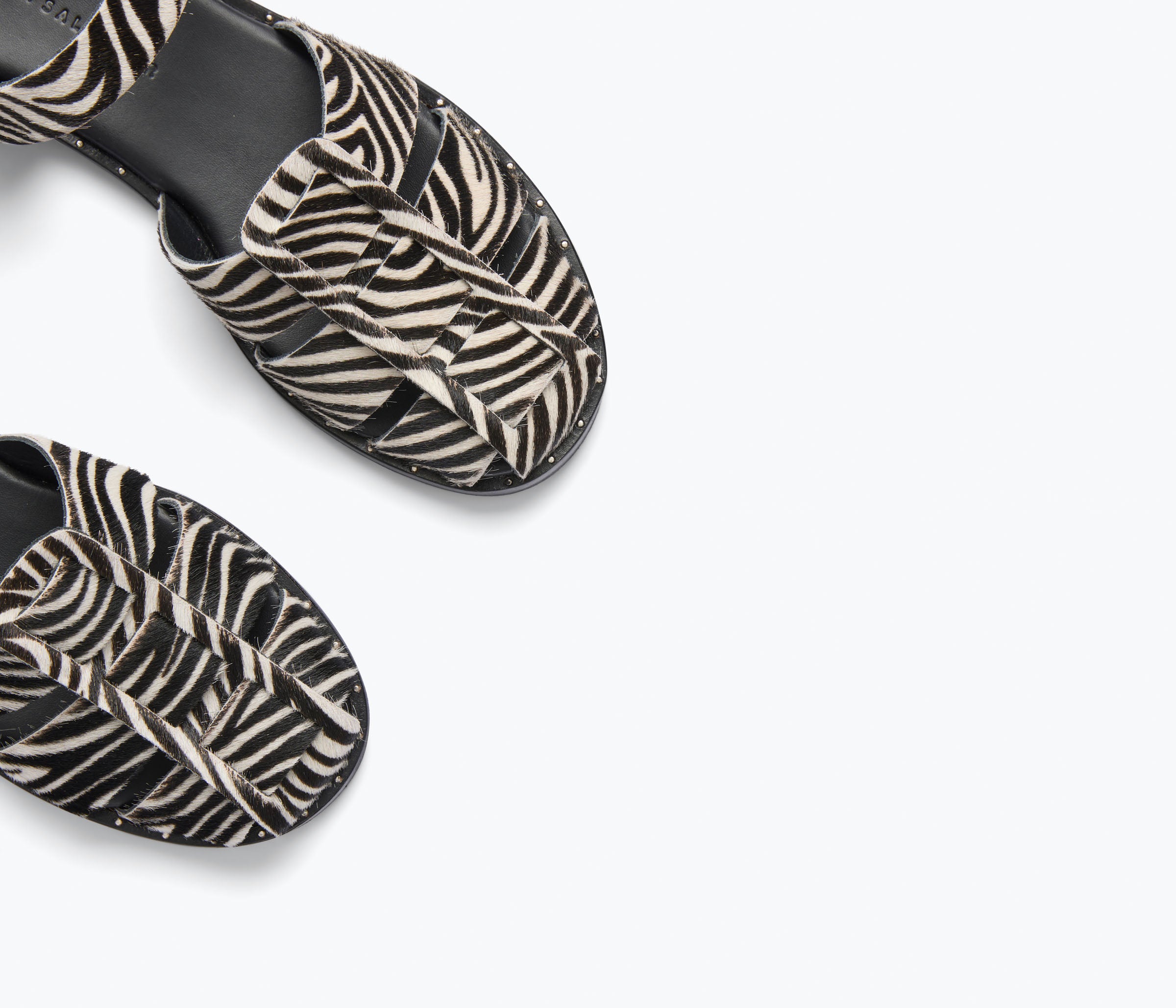 Freda Salvador Sera Fisherman Sandal with zebra print hair calf leather, showcasing detailed strap and textured material.