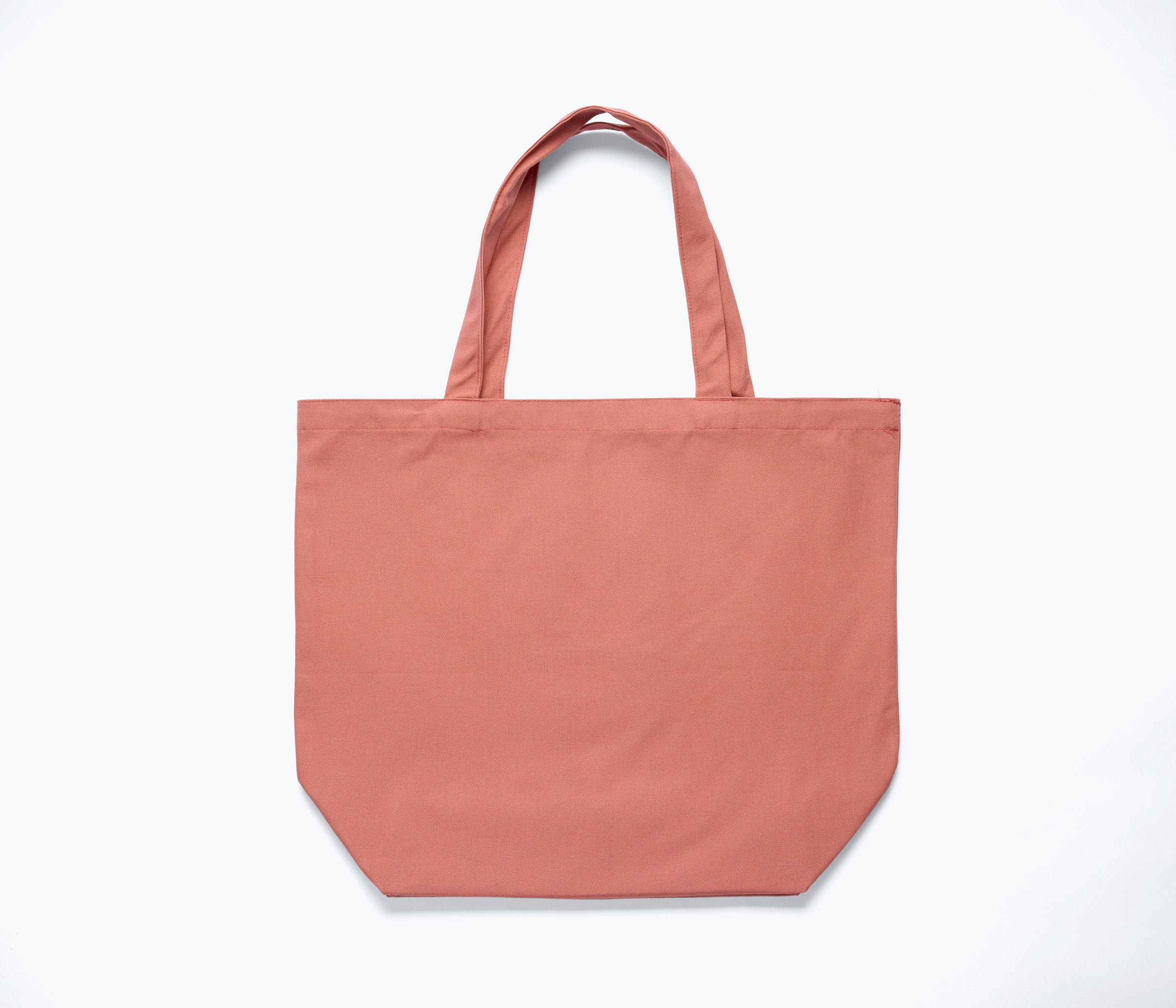 Limited edition Freda Salvador illustrated tote bag in dusty rose with detailed marketing material design on the back.