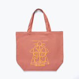 Freda Salvador limited edition illustrated tote bag in dusty rose color, showcasing artistic design on front.