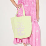 Mint canvas illustrated tote bag by Freda Salvador, featuring unique artwork, perfect for accessories and everyday use.