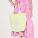 Mint canvas illustrated tote bag by Freda Salvador, featuring unique artwork, perfect for accessories and everyday use.