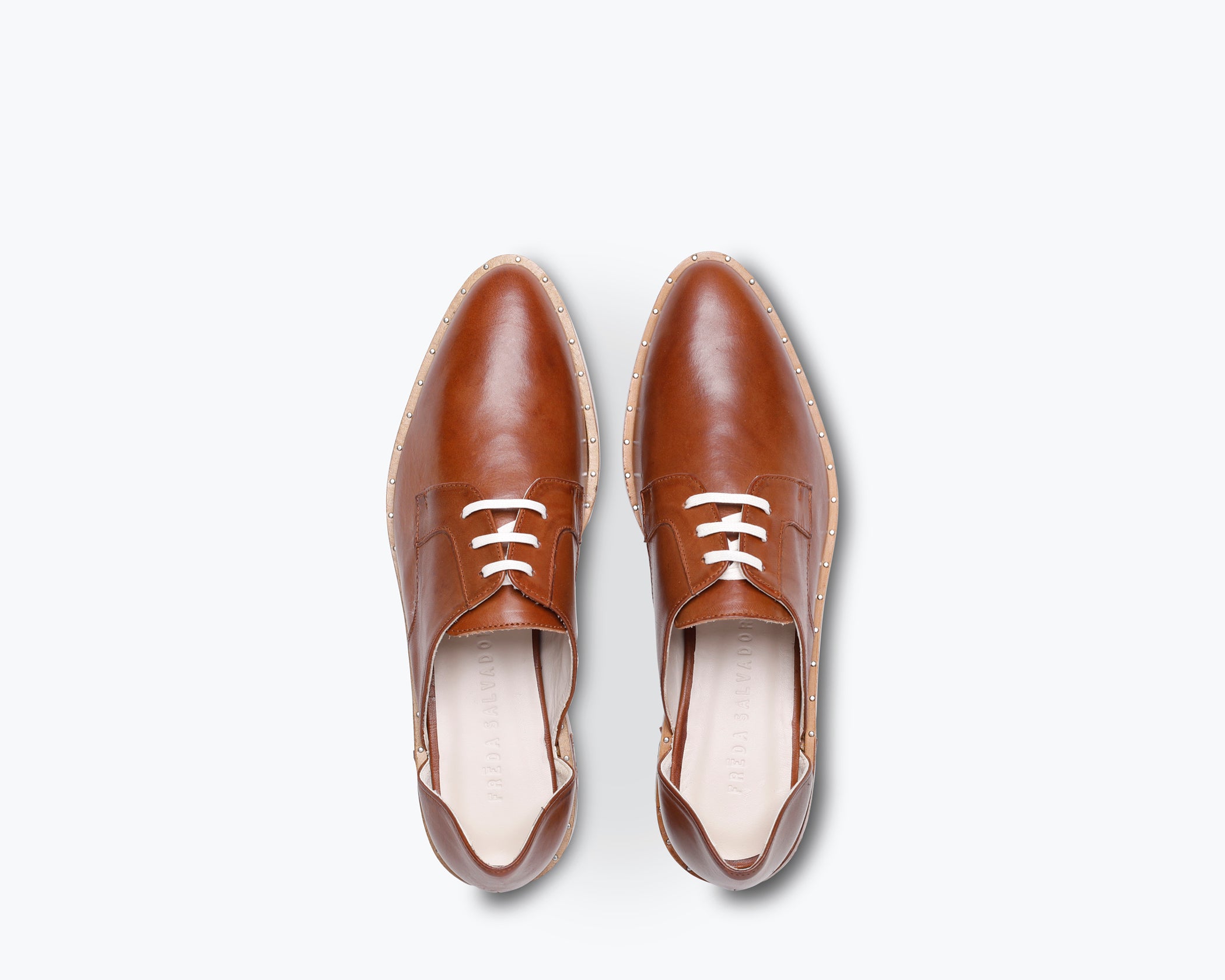 FRĒDA SALVADOR WIT D'ORSAY loafer featuring sleek leather design and classic slip-on style, displayed on a neutral background.