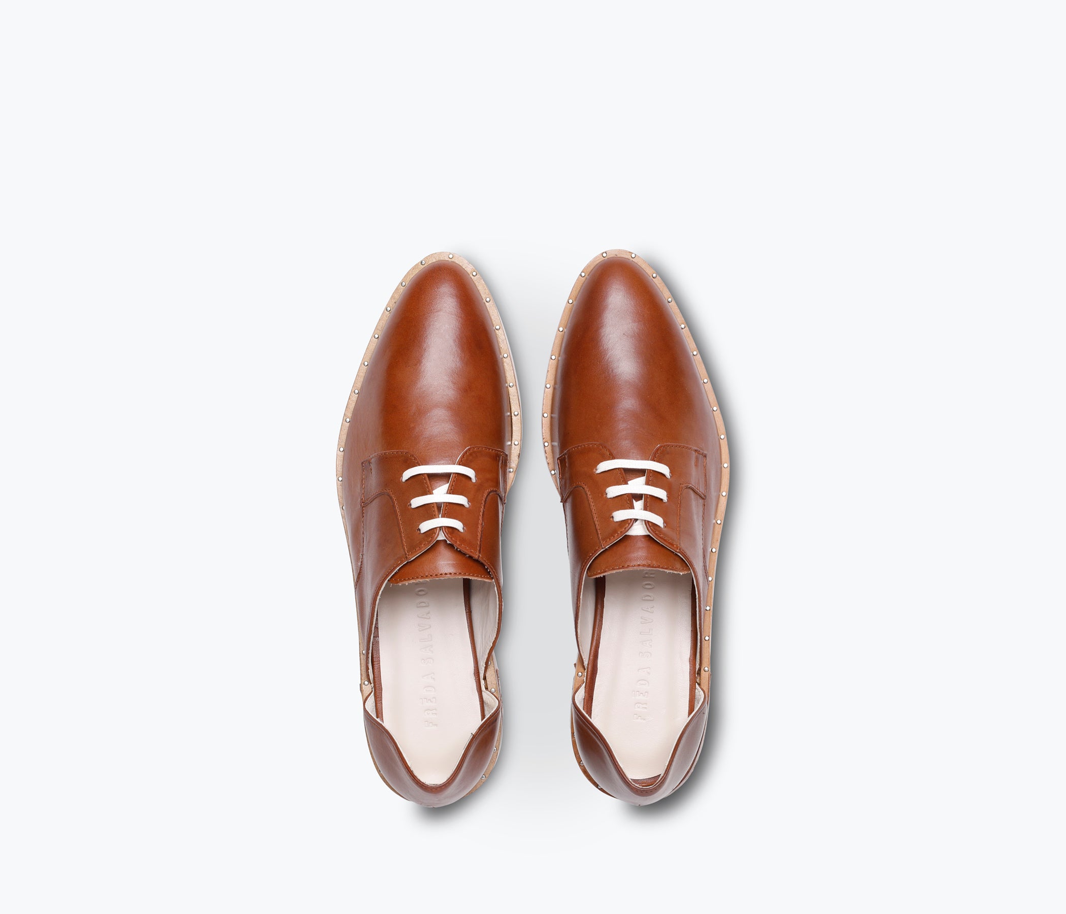 FRĒDA SALVADOR WIT D'ORSAY loafer featuring sleek leather design and classic slip-on style, displayed on a neutral background.