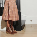Brown suede ACE lace-up boots by FRĒDA SALVADOR with sturdy soles and classic design, perfect for casual fall outfits.