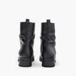 FRĒDA SALVADOR hike boot with shearling lining, showing the back view of the rugged outdoor footwear with durable sole and stylish design.