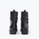FRĒDA SALVADOR hike boot with shearling lining, showing the back view of the rugged outdoor footwear with durable sole and stylish design.