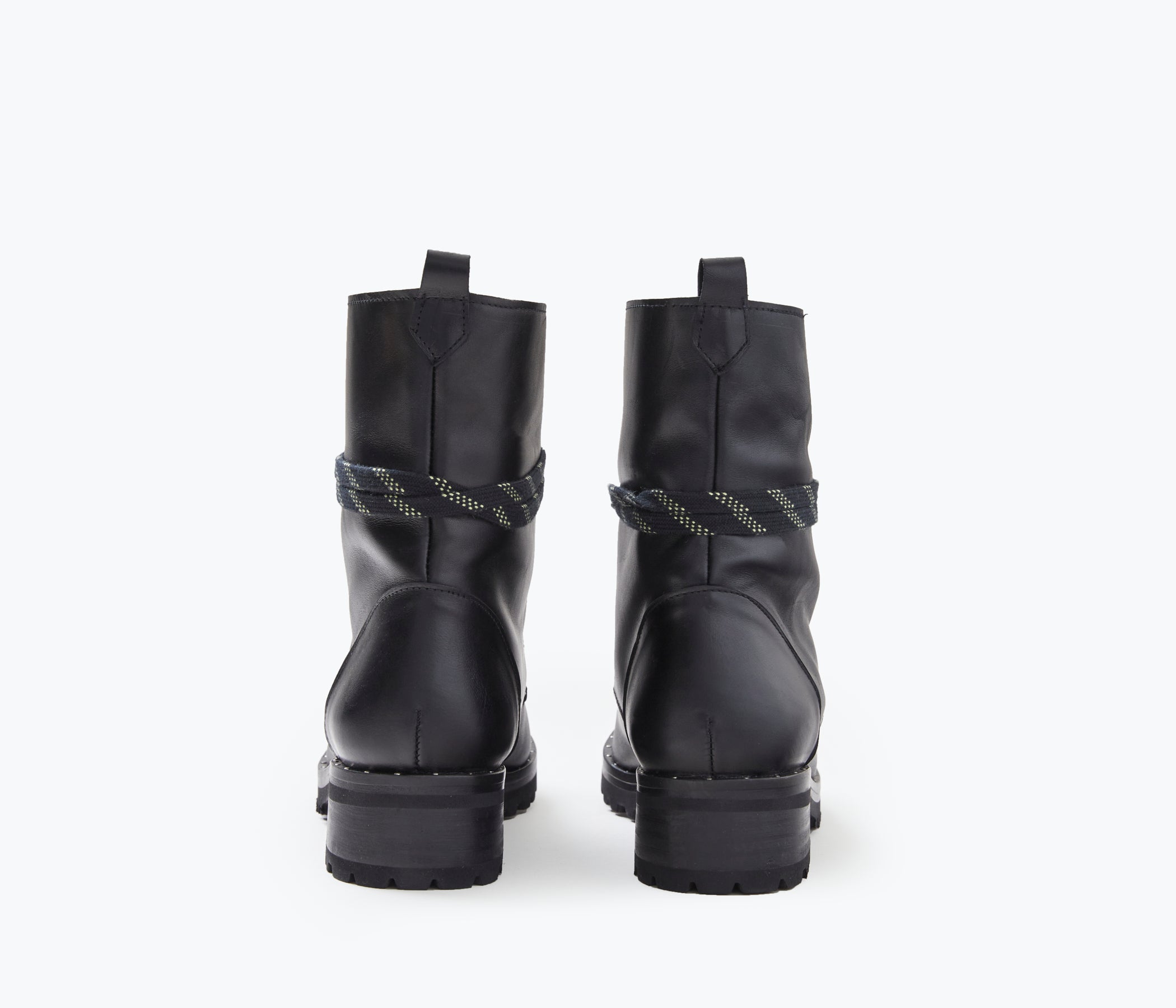 FRĒDA SALVADOR hike boot with shearling lining, showing the back view of the rugged outdoor footwear with durable sole and stylish design.