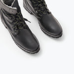 FRĒDA SALVADOR hike boot with shearling lining, featuring rugged design and ankle-high style, shown from the top angle.