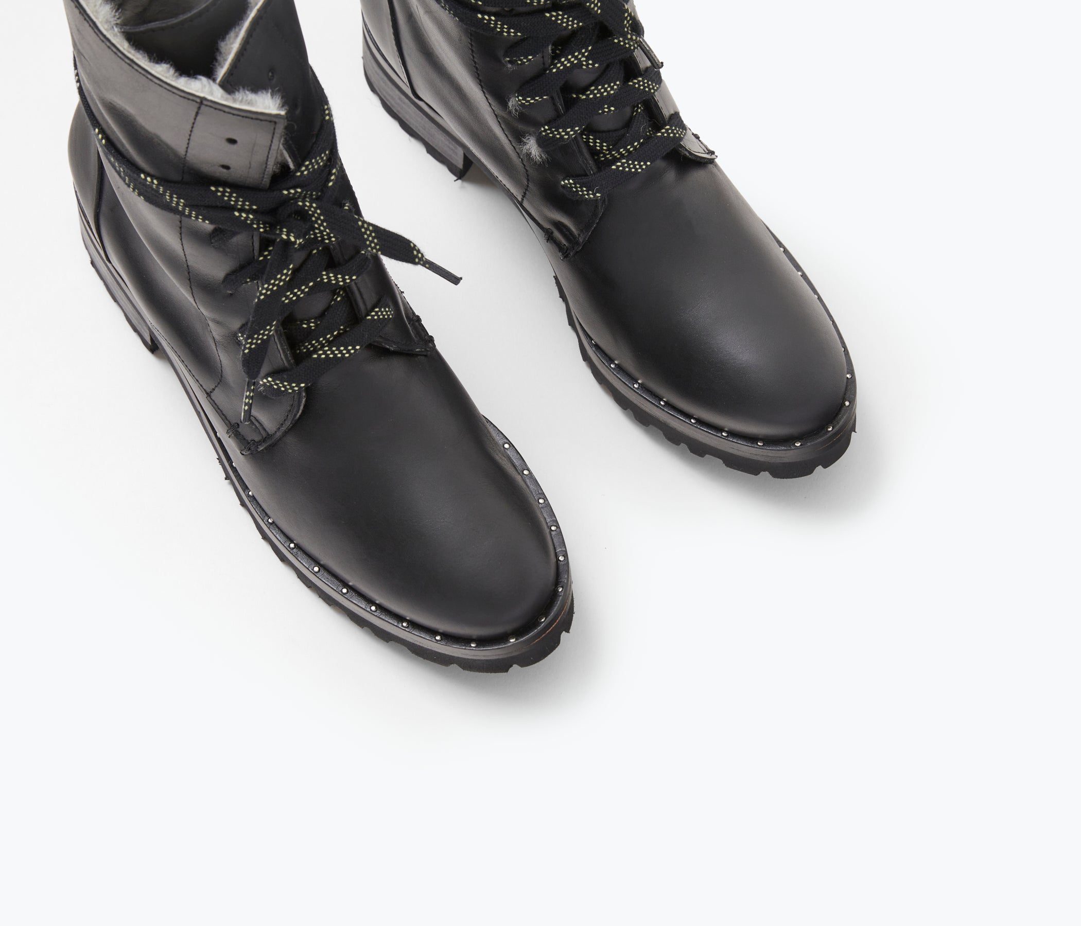 FRĒDA SALVADOR hike boot with shearling lining, featuring rugged design and ankle-high style, shown from the top angle.