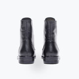 Freda Salvador Ralf lace-up boot featuring smooth leather, rounded toe, chunky heel, and stylish design on a neutral background.