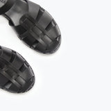 Black SERA Fisherman Sandal by FREDA SALVADOR featuring a woven strap design and open toe style.