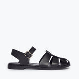 Black SERA FISHERMAN SANDAL by FREDA SALVADOR featuring a closed-toe design and adjustable strap, front view.