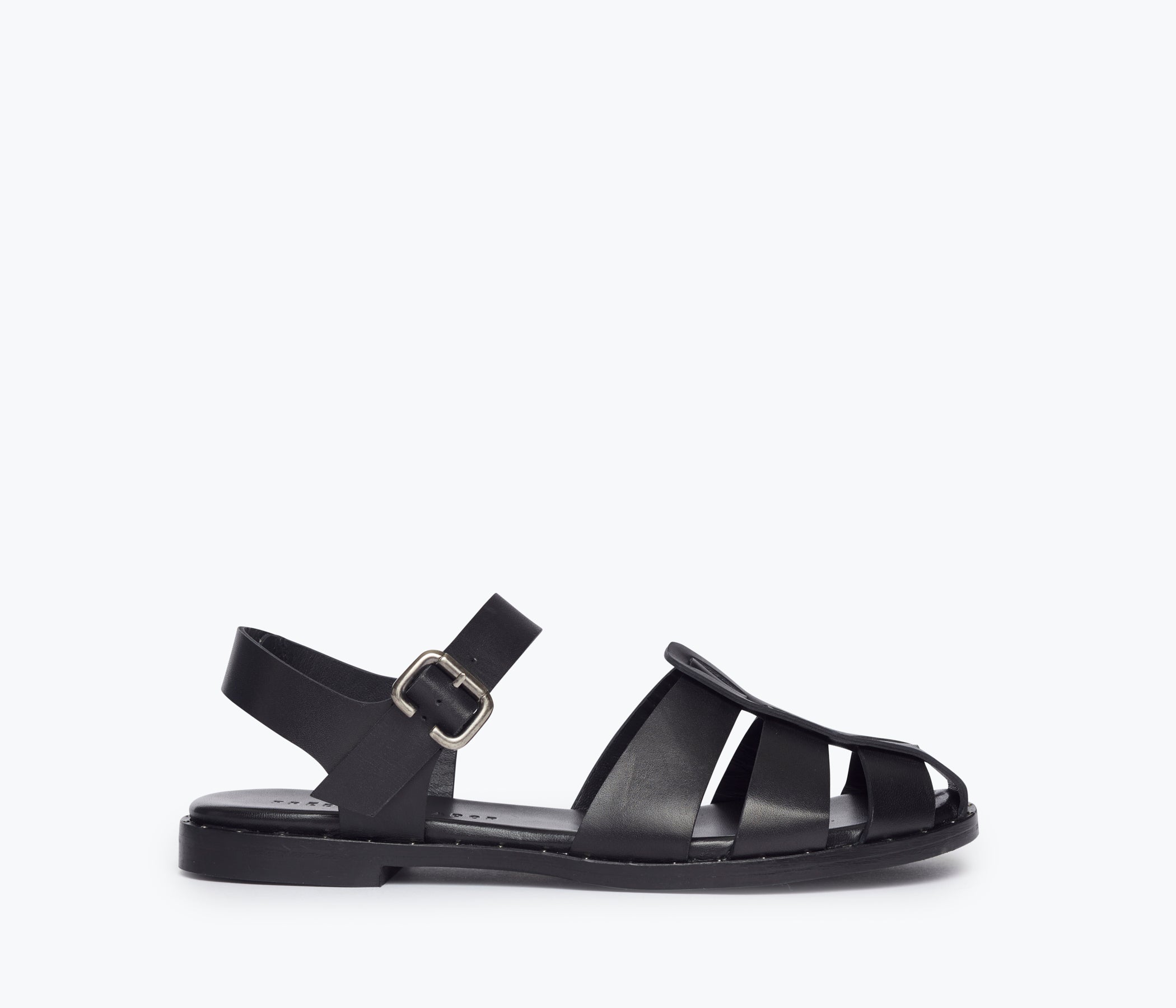 Black SERA FISHERMAN SANDAL by FREDA SALVADOR featuring a closed-toe design and adjustable strap, front view.