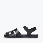 Black SERA Fisherman Sandal by FREDA SALVADOR with leather straps and inside view showing detailed craftsmanship.