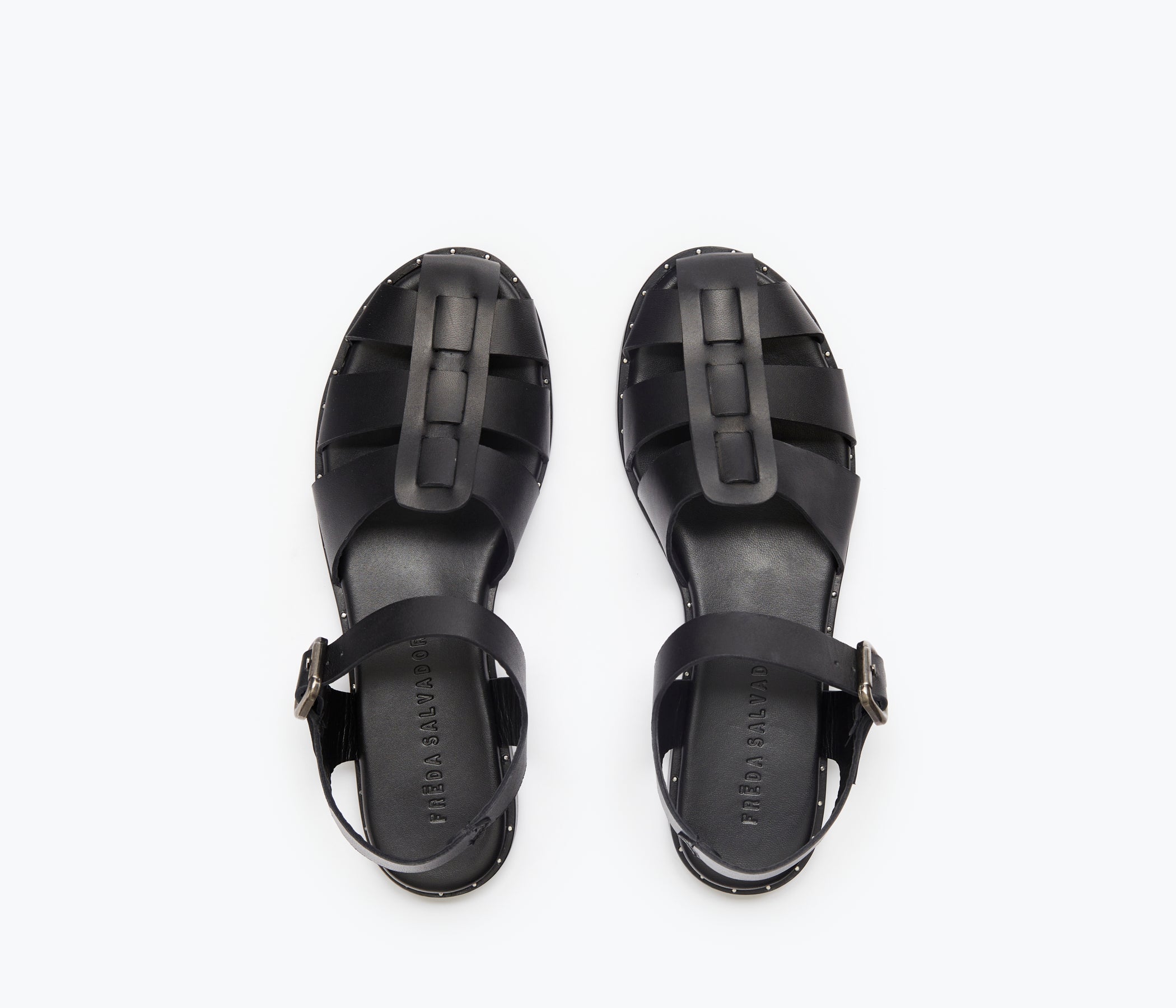 Black SERA FISHERMAN sandal by FREDA SALVADOR with a woven strap design and closed toe, perfect for casual summer wear.