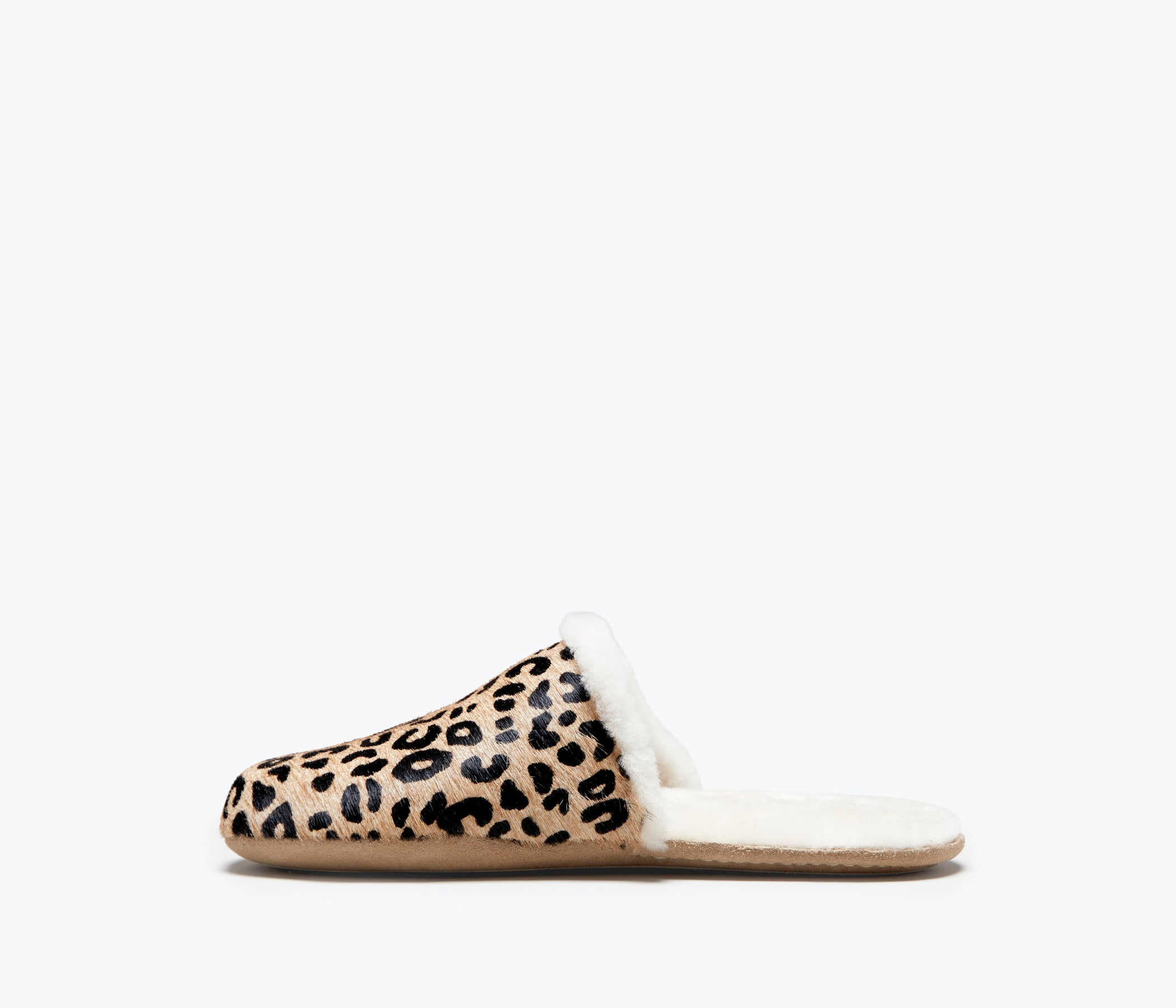 Freda Salvador James shearling slip-on slippers in tan and black, showing soft shearling lining and comfortable interior.